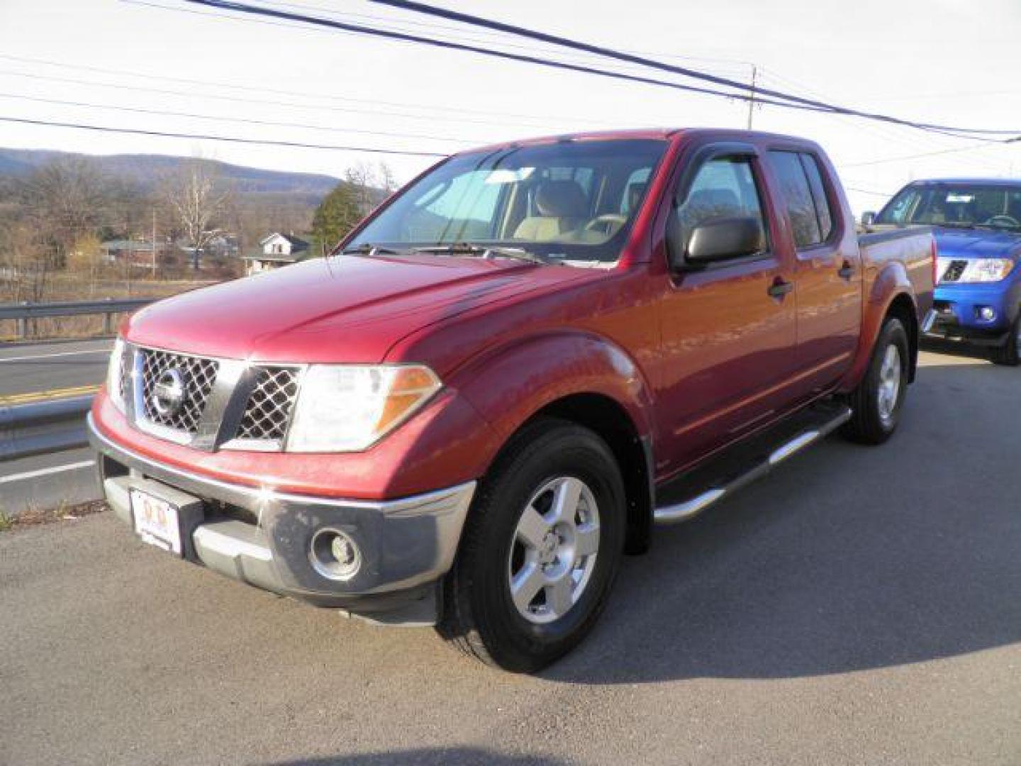 2007 RED Nissan Frontier SE Crew Cab 2WD (1N6AD07U17C) with an 4.0L V6 engine, AT transmission, located at 15520 McMullen Hwy SW, Belair, MD, 21502, (301) 729-3700, 39.581375, -78.846451 - Photo#0