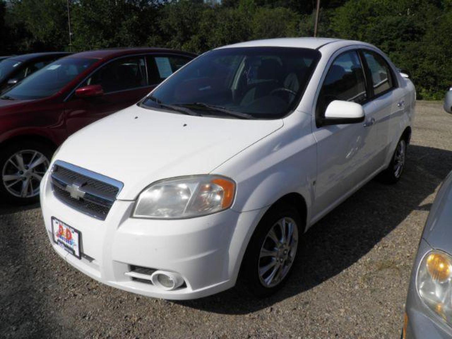 2009 White Chevrolet Aveo LT (KL1TG56E39B) with an 1.6l L4 engine, AT transmission, located at 19521 New George's Creek Rd SW, Barton, MD, 21521, (301) 463-2404, 39.524323, -79.017906 - Photo#0