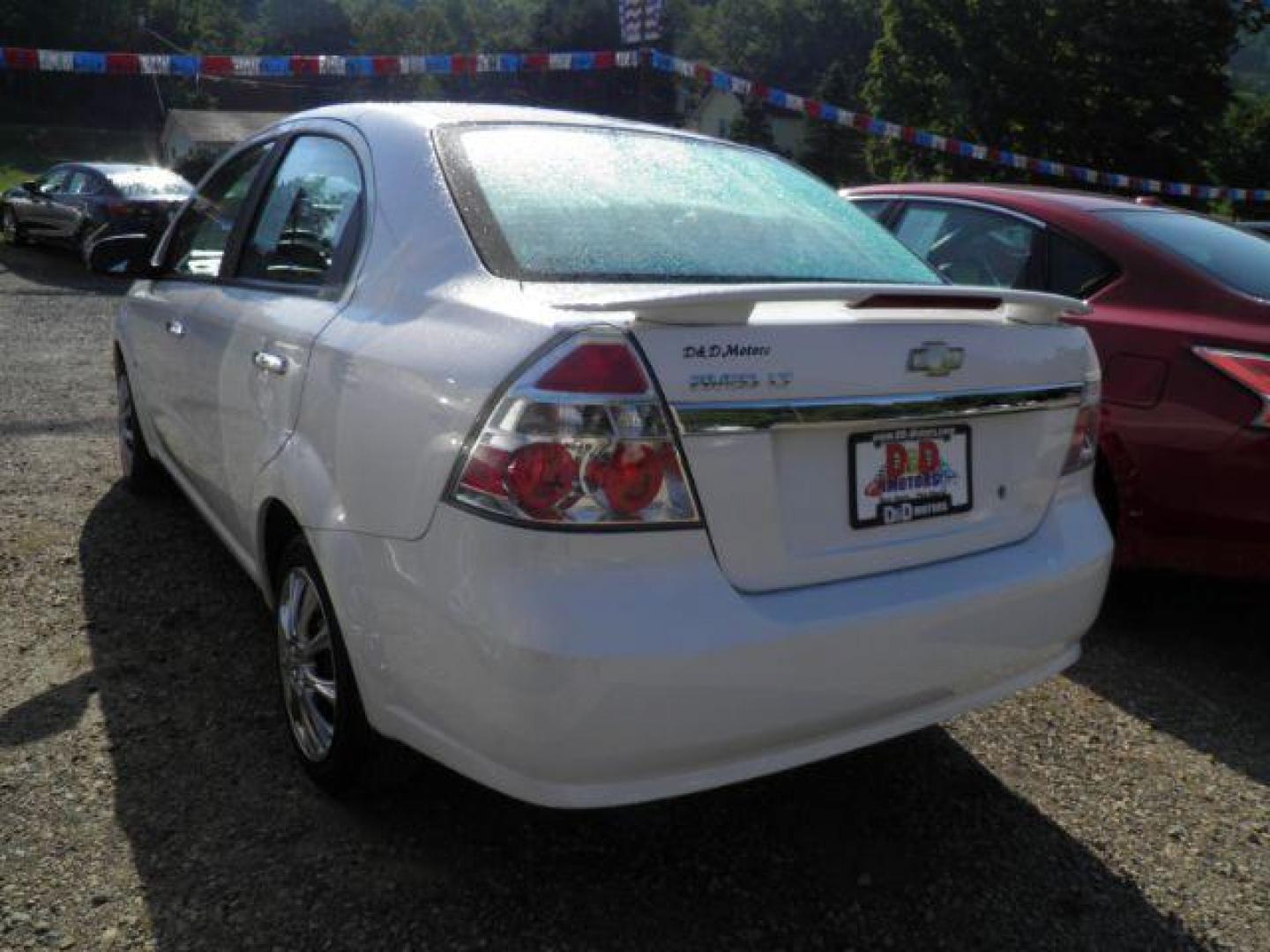 2009 White Chevrolet Aveo LT (KL1TG56E39B) with an 1.6l L4 engine, AT transmission, located at 19521 New George's Creek Rd SW, Barton, MD, 21521, (301) 463-2404, 39.524323, -79.017906 - Photo#4