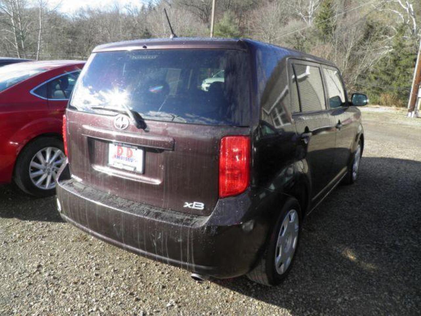 2009 Purple Scion xB Wagon (JTLKE50E091) with an 2.4/cly engine, 5SP transmission, located at 19521 New George's Creek Rd SW, Barton, MD, 21521, (301) 463-2404, 39.524323, -79.017906 - Photo#5