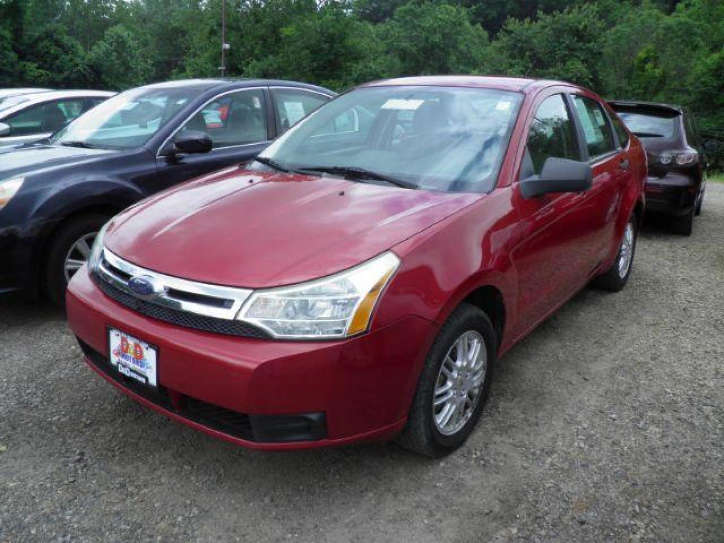 2010 RED Ford Focus SE Sedan (1FAHP3FN2AW) with an 2.0L L4 engine, 5SP transmission, located at 19521 New George's Creek Rd SW, Barton, MD, 21521, (301) 463-2404, 39.524323, -79.017906 - Photo#0