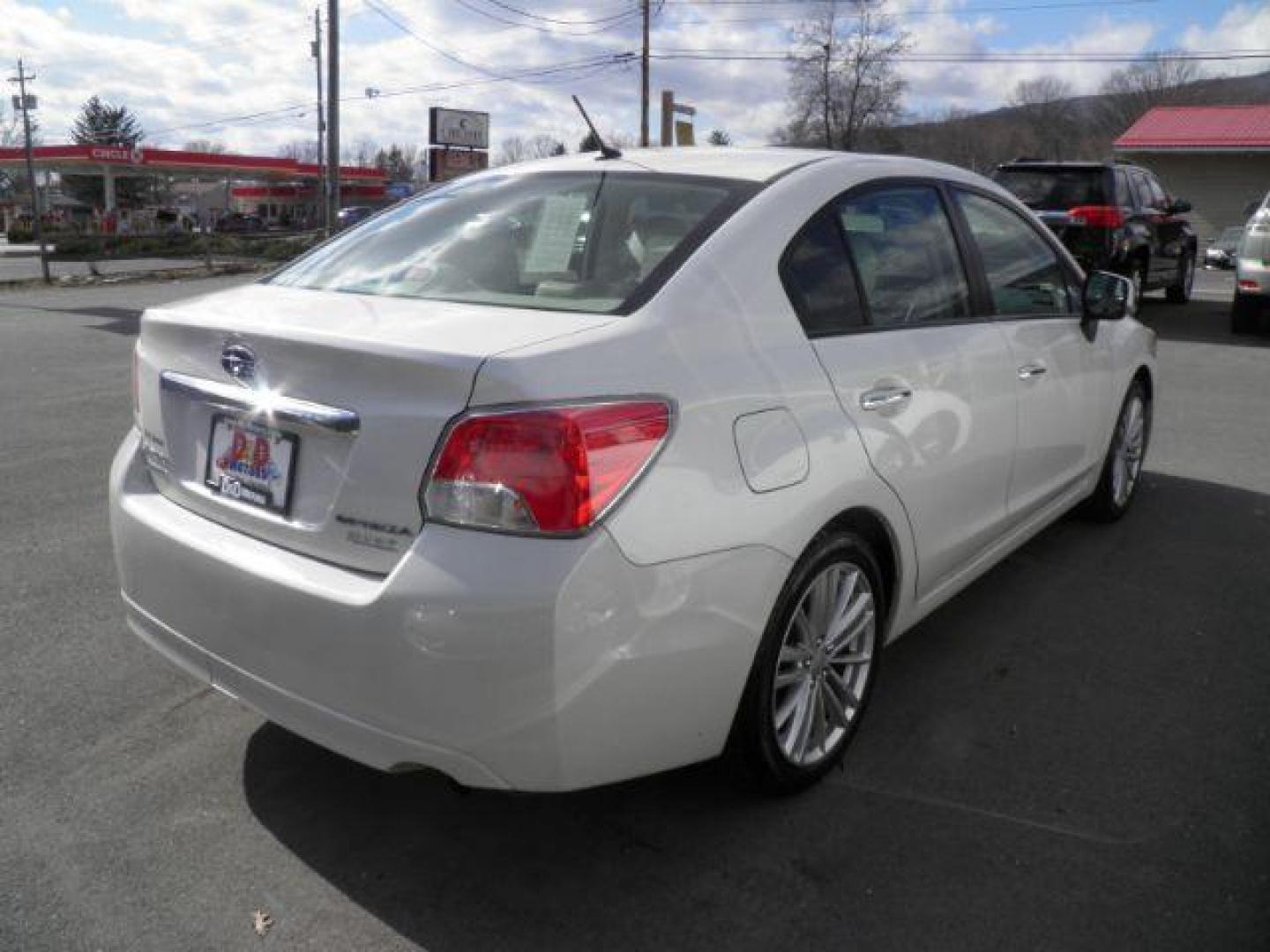 2012 WHITE Subaru Impreza Limited 4-Door (JF1GJAG63CH) with an 2.0L L4 engine, AT transmission, located at 15520 McMullen Hwy SW, Belair, MD, 21502, (301) 729-3700, 39.581375, -78.846451 - Photo#4