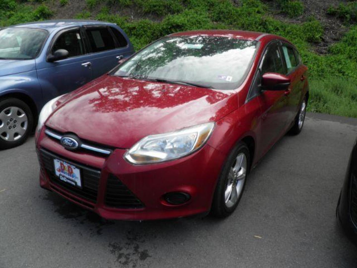 2013 RED Ford Focus SE Hatch (1FADP3K22DL) with an 2.0l L4 engine, AT transmission, located at 15520 McMullen Hwy SW, Belair, MD, 21502, (301) 729-3700, 39.581375, -78.846451 - Photo#0