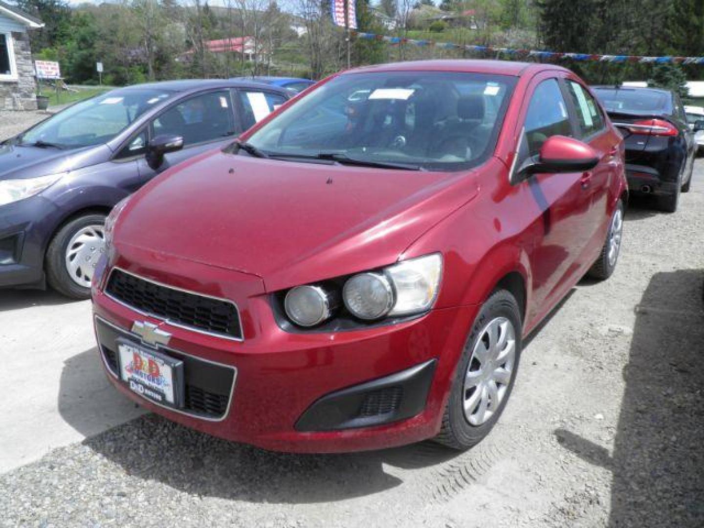 2014 RED Chevrolet Sonic LS Manual Sedan (1G1JB5SH5E4) with an 1.8l L4 engine, 5SP transmission, located at 19521 New George's Creek Rd SW, Barton, MD, 21521, (301) 463-2404, 39.524323, -79.017906 - Photo#0