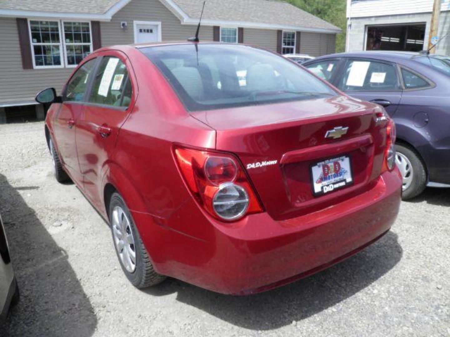 2014 RED Chevrolet Sonic LS Manual Sedan (1G1JB5SH5E4) with an 1.8l L4 engine, 5SP transmission, located at 19521 New George's Creek Rd SW, Barton, MD, 21521, (301) 463-2404, 39.524323, -79.017906 - Photo#4