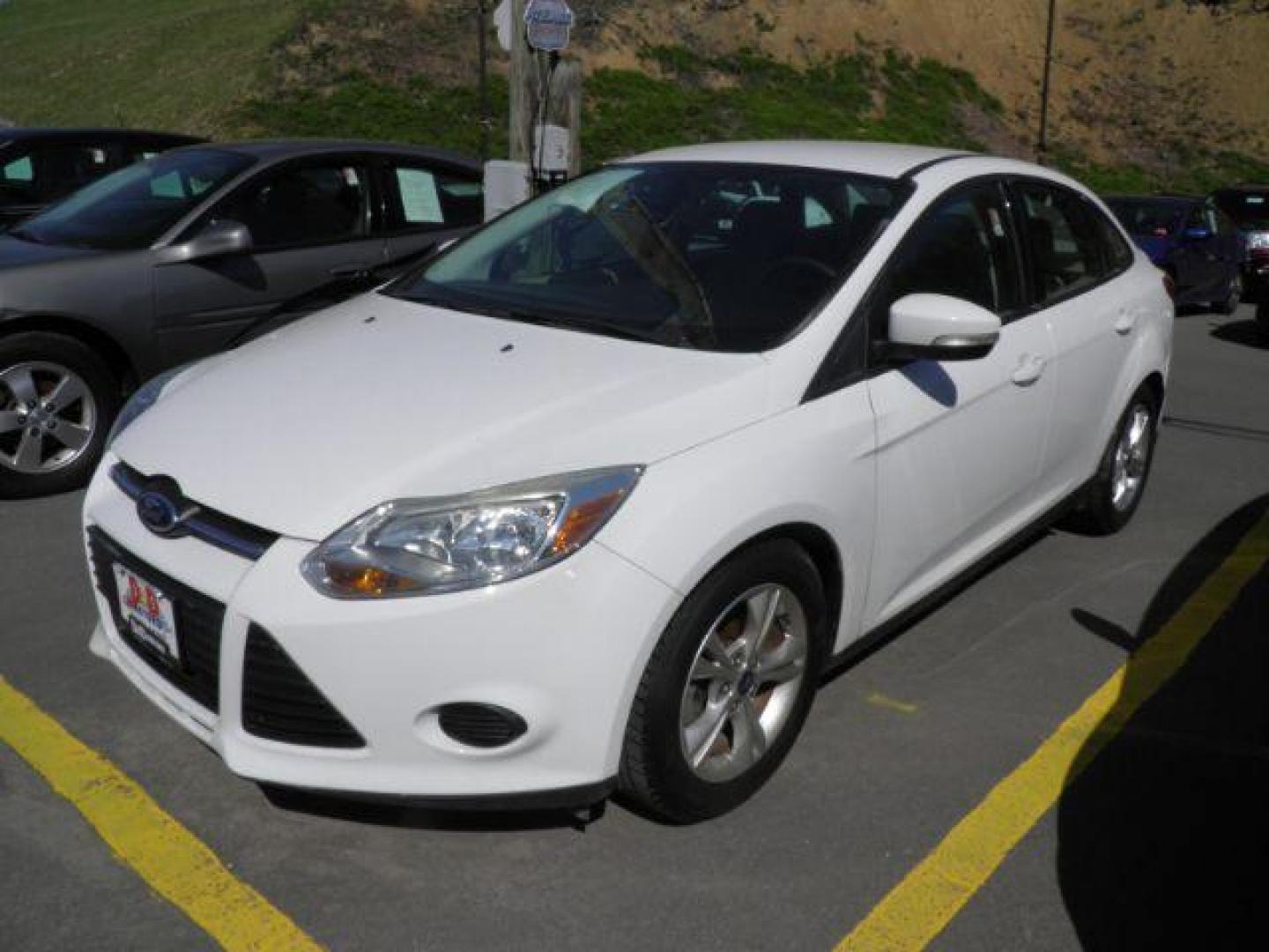 2014 WHITE Ford Focus SE Sedan (1FADP3F26EL) with an 2.0L L4 engine, located at 15520 McMullen Hwy SW, Belair, MD, 21502, (301) 729-3700, 39.581375, -78.846451 - Photo#0