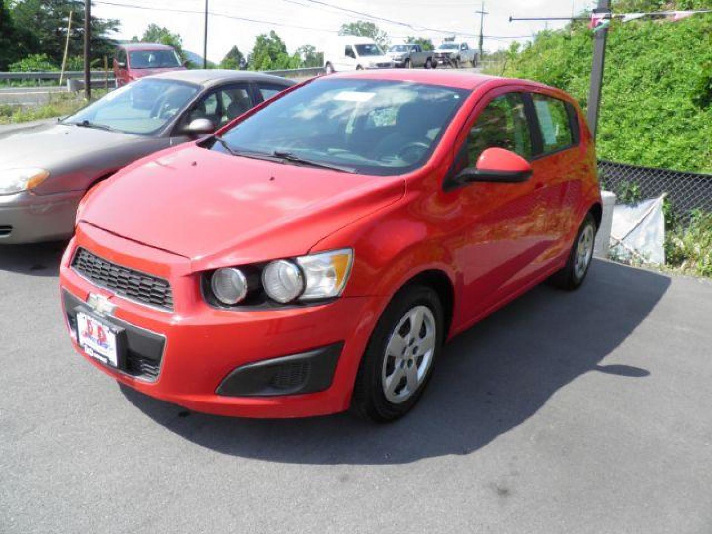 2015 RED Chevrolet Sonic LS Auto 5-Door (1G1JA6SG8F4) with an 1.8l L4 engine, AT transmission, located at 19521 New George's Creek Rd SW, Barton, MD, 21521, (301) 463-2404, 39.524323, -79.017906 - Photo#0