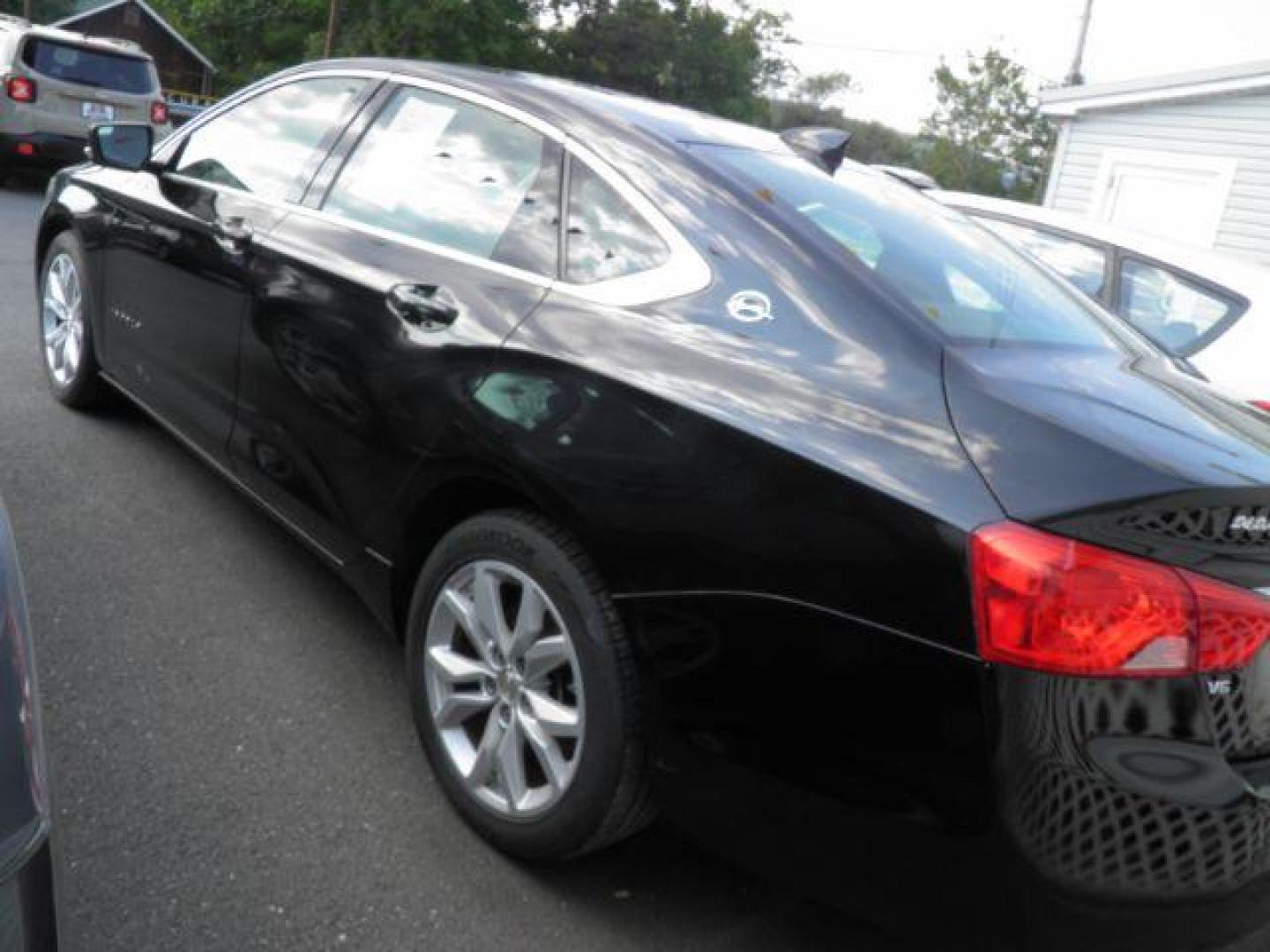 2016 Black Chevrolet Impala LT (2G1115S33G9) with an 3.6L V6 engine, AT transmission, located at 19521 New George's Creek Rd SW, Barton, MD, 21521, (301) 463-2404, 39.524323, -79.017906 - Photo#4