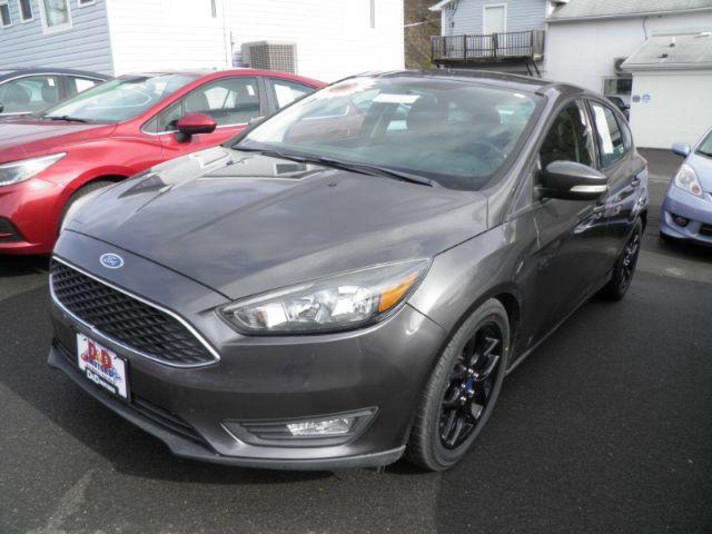 2016 GRAY Ford Focus SE Hatch (1FADP3K27GL) with an 2.0L L4 engine, AT transmission, located at 19521 New George's Creek Rd SW, Barton, MD, 21521, (301) 463-2404, 39.524323, -79.017906 - Photo#0