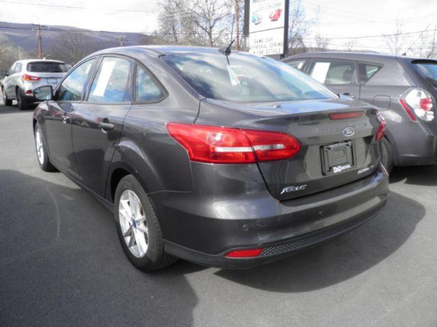 2016 GRAY Ford Focus SE Sedan (1FADP3F29GL) with an 2.0L L4 engine, AT transmission, located at 15520 McMullen Hwy SW, Belair, MD, 21502, (301) 729-3700, 39.581375, -78.846451 - Photo#4