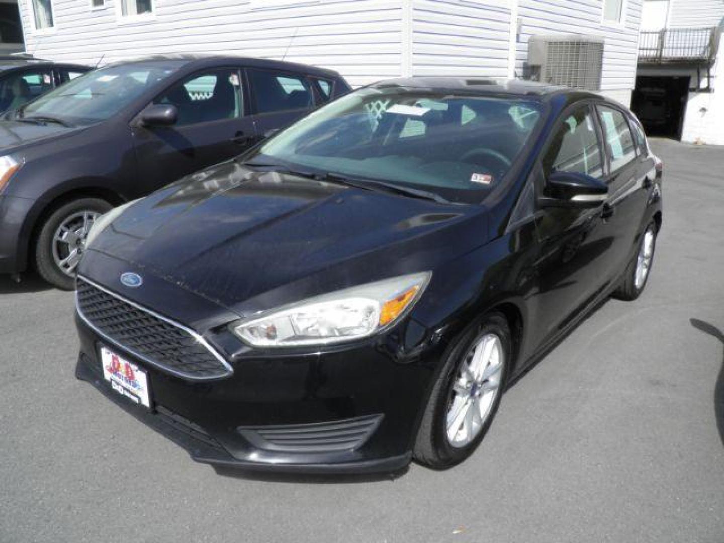 2016 BLACK Ford Focus SE Hatch (1FADP3K29GL) with an 2.0L L4 engine, AT transmission, located at 19521 New George's Creek Rd SW, Barton, MD, 21521, (301) 463-2404, 39.524323, -79.017906 - Photo#0