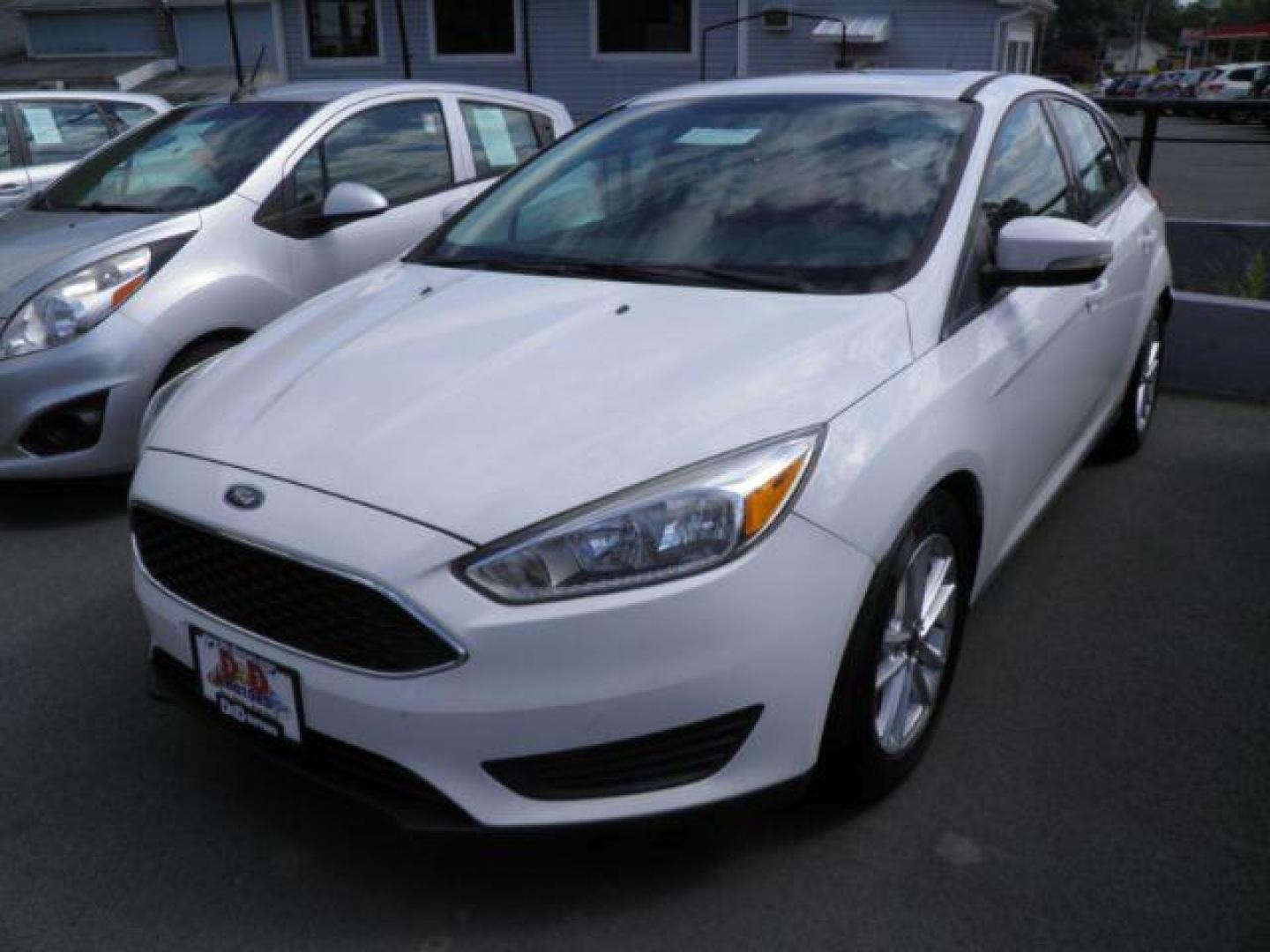 2016 WHITE FORD FOCUS SE Hatch (1FADP3K25GL) with an 2.0L L4 engine, AT transmission, located at 19521 New George's Creek Rd SW, Barton, MD, 21521, (301) 463-2404, 39.524323, -79.017906 - Photo#0