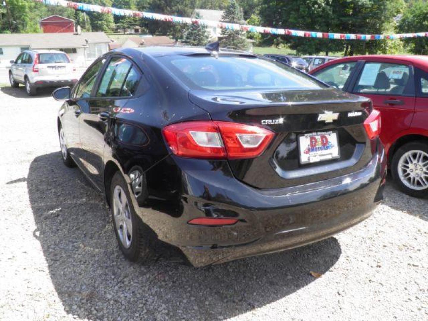 2017 BLACK Chevrolet Cruze LS Auto (1G1BC5SM7H7) with an 1.4L 4L engine, AT transmission, located at 19521 New George's Creek Rd SW, Barton, MD, 21521, (301) 463-2404, 39.524323, -79.017906 - Photo#4